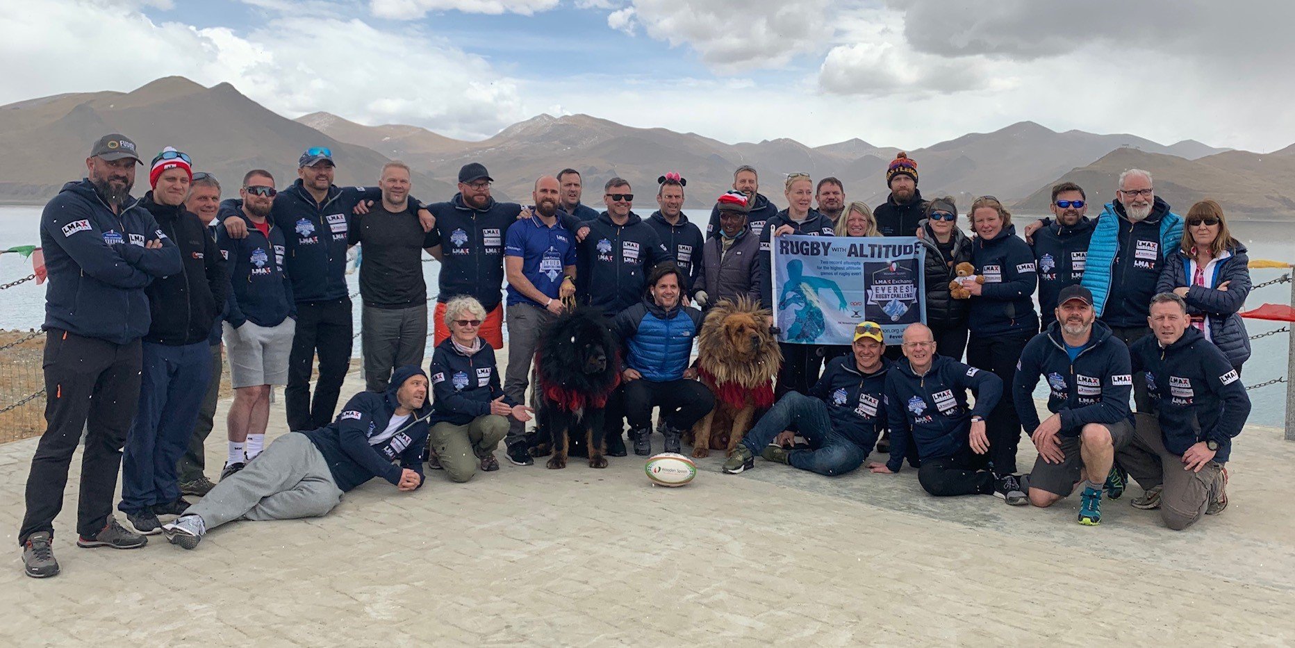 LMAX Rugby Challenge rugby team is posing in a group photo in Tibetan plateau and highlands.